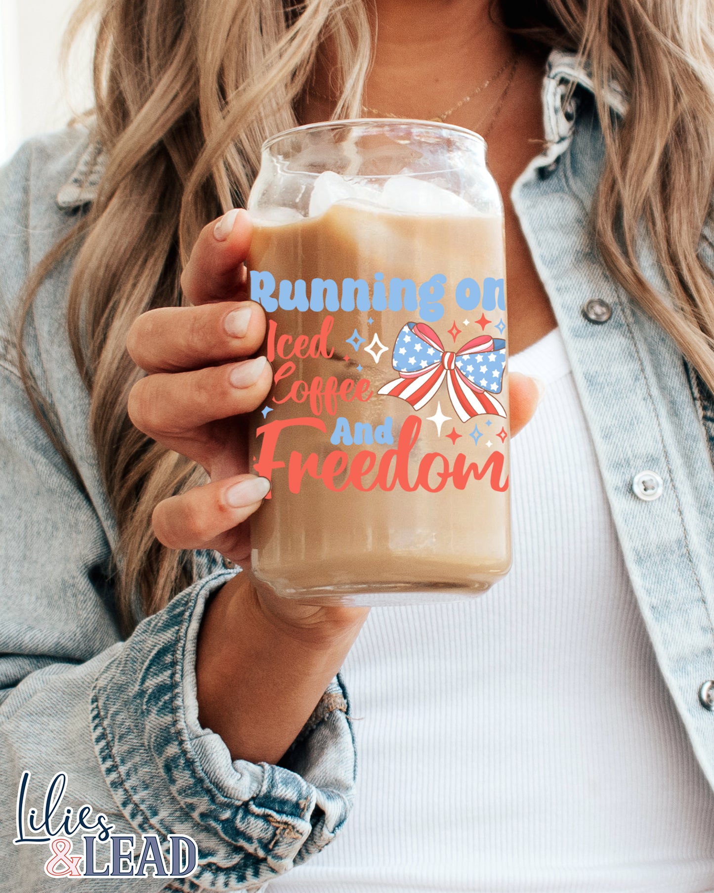 16oz glass can cup featuring the saying running on iced coffee and freedom with a patriotic bow and stars