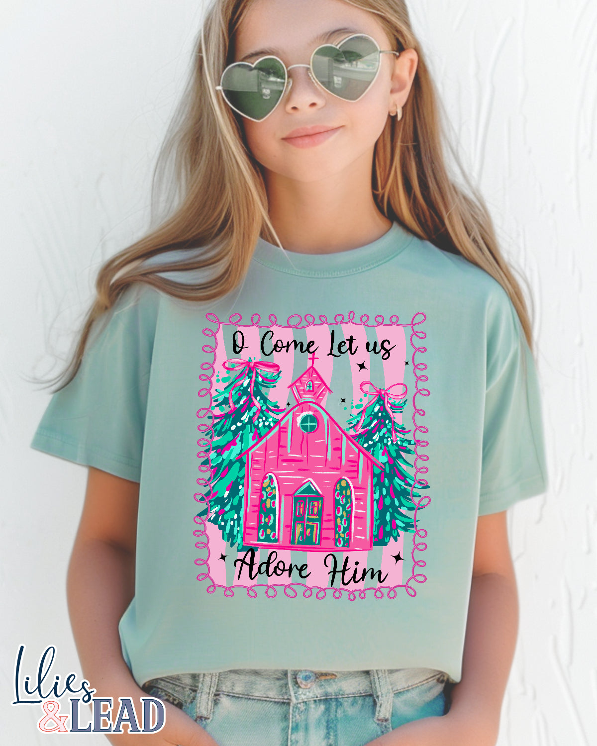 Girl wearing a t-shirt with a Christmas design and text on a white background