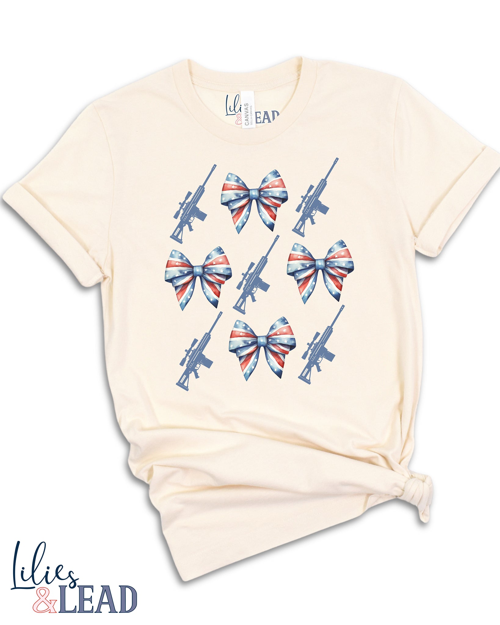 Tee shirt flatlay with patriotic bows and rifle detail 