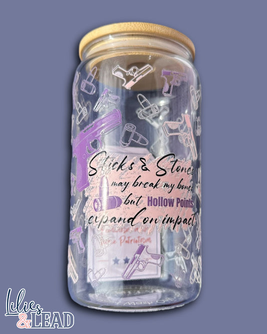 16oz glass can product photo featuring Sticks and Stones may break my bones but hollow points expand on impact design with rifle and bullet details.